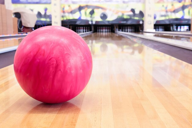 Pink ball on floor in bowling club