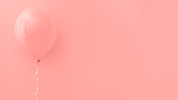 Photo pink balloon on pink background