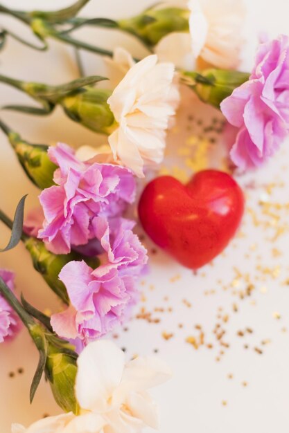 Pink and beige dianthus and heart