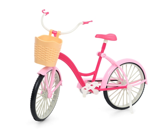 Pink bicycle with a basket isolated