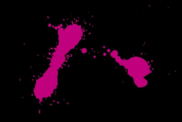 Pink blot on a black background Spots of paint on a piece of paper