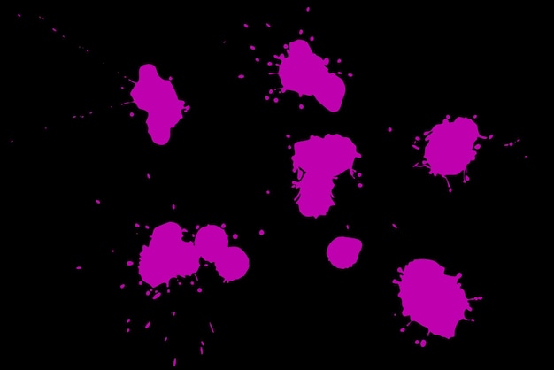 Pink blot on a black background Spots of paint on a piece of paper