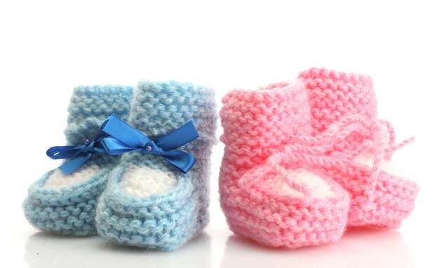 Pink and blue baby boots isolated on white