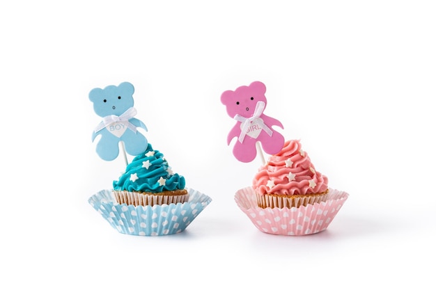 Pink and blue cupcakes for baby shower isolated on white background