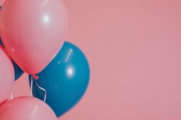 Pink and blue helium balloons