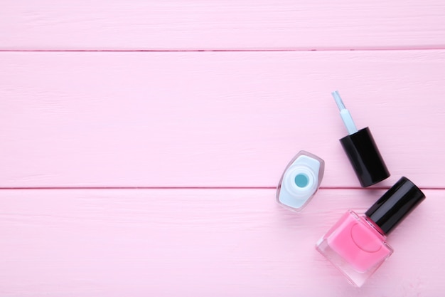 Photo pink and blue nail polishes on pink