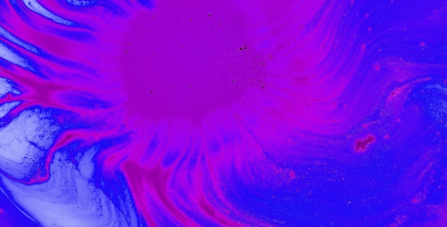 A pink and blue swirl in a blue background