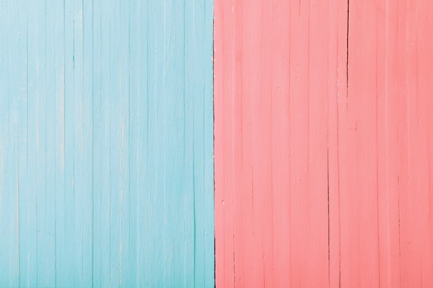 Pink and blue wooden background. Man and woman concept