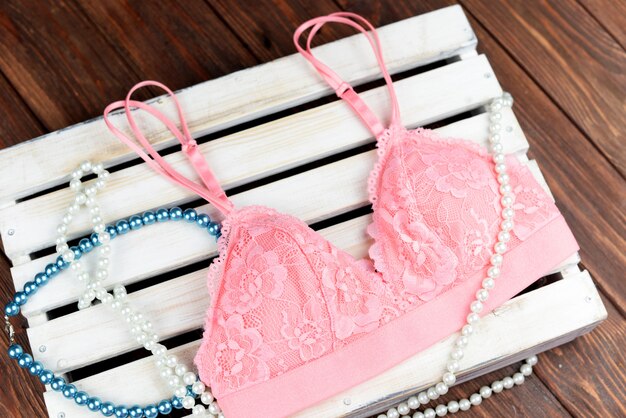 Pink bra with beads collar