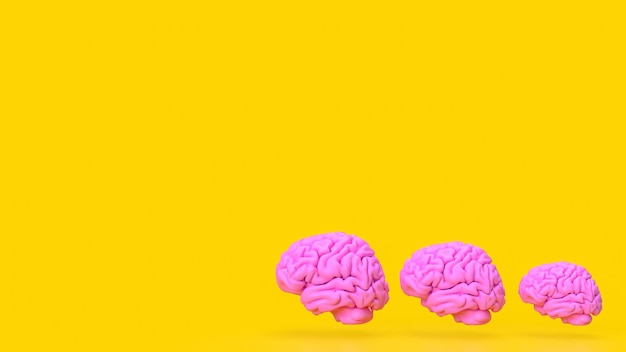 Photo the pink brain on yellow background 3d rendering