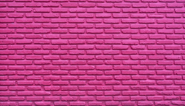 Photo pink brick wall abstract background. pink rough brick wall texture.