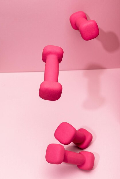 pink bright dumbbells flying air