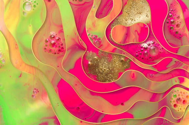 Pink bubbles background with gold wavy layers and golden dust