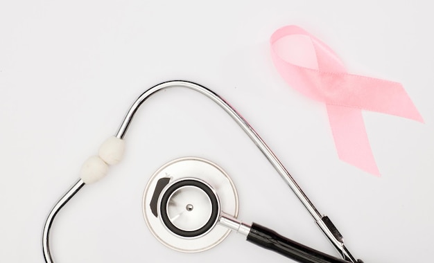 Pink cancer ribbon stethoscope white background international symbol of breast cancer