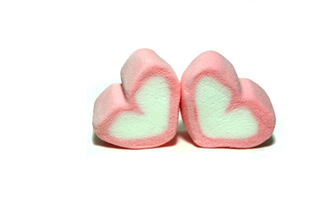 Pink candy hearts for valentines day on white background