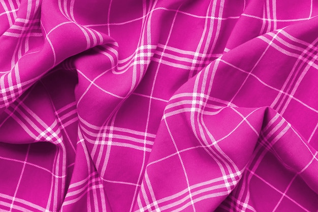 Pink checkered plaid clothes material. 