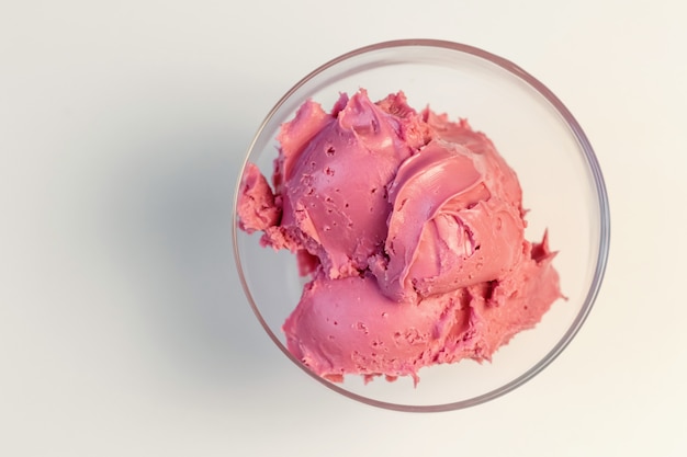 Pink cherry cream for cake. Sweet cream in glass bowl. Confectionery, sweet life, calories.