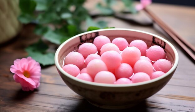 Pink chinese glutinous round balls soup in chinese bowl