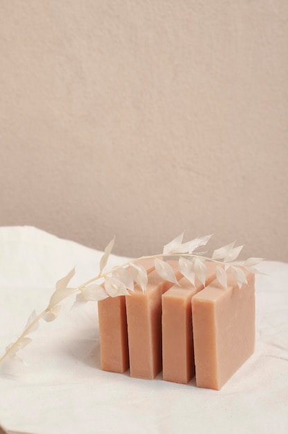 Pink clay handmade soap bars with dried flowers