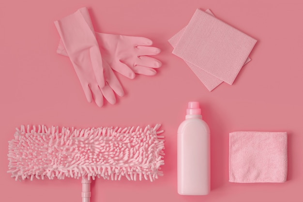 Pink cleaning kit in the house on pink.