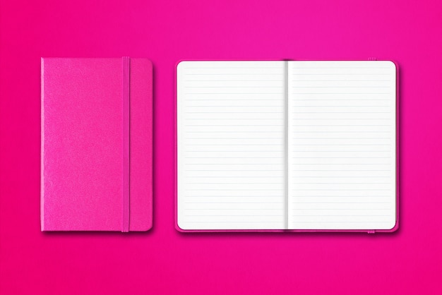 Pink closed and open lined notebooks isolated