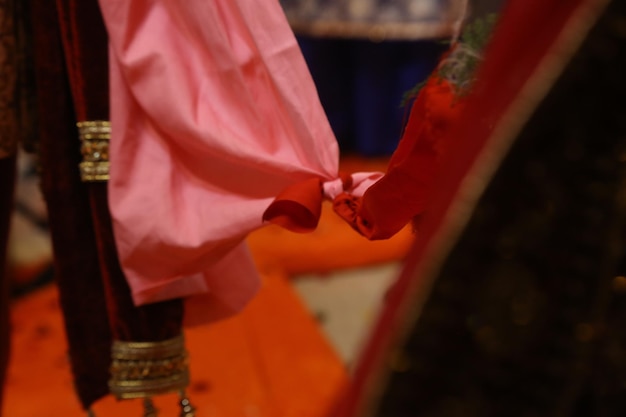 Photo a pink cloth is draped over a red cloth.