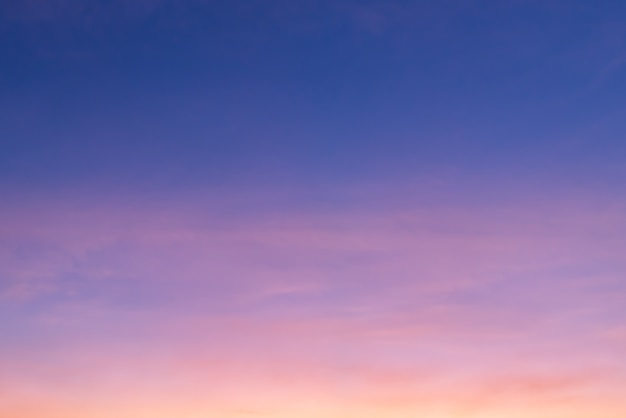 Pink cloud and pink light of the sun through the clouds and blue sky with copy space