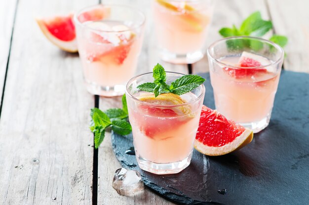 Pink cocktail with ice and mint