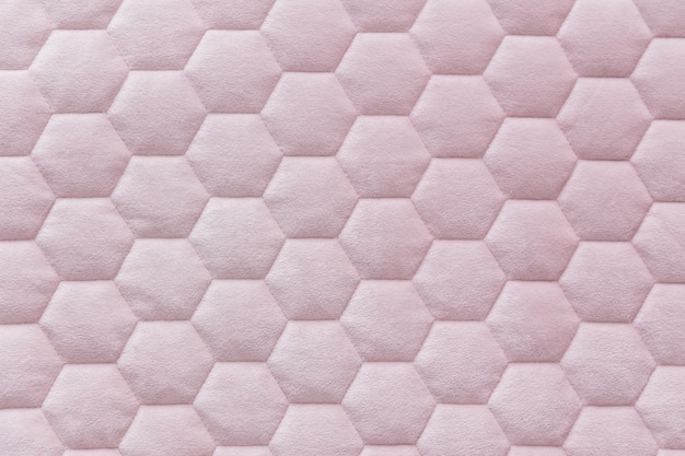 Pink color hexagon mesh fabric textured background