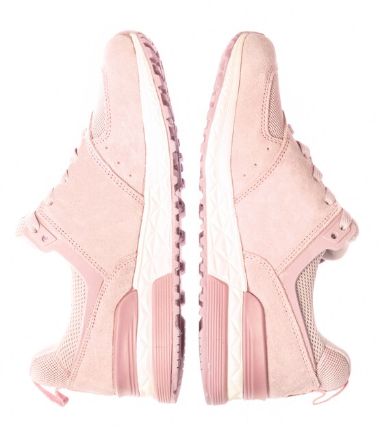 Photo pink-colored sports sneakers isolated