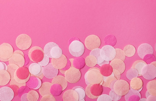 Pink confetti on pastel pink background Festive background  for your design