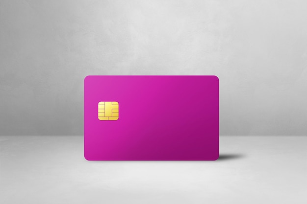 Pink credit card on a white concrete background