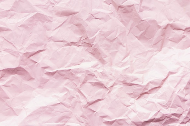 Pink crumpled paper texture background for design with empty copy space for text