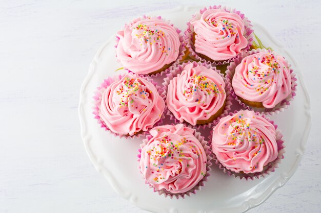 Pink cupcakes  on cake stand top view