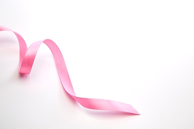 Pink curly ribbon isolated on white