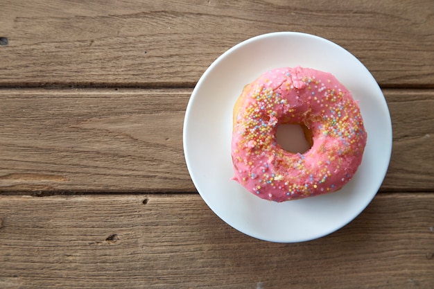 pink donut on a plate 