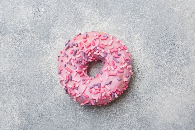 Pink doughnut. Top view Flat lay.