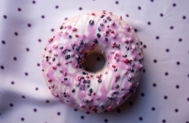 Pink doughnut with colorful decoration