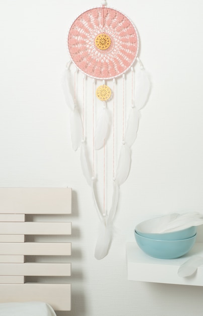 Pink dream catcher with white feathers