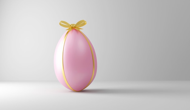 Uovo di pasqua rosa con nastro dorato e fiocco su bianco