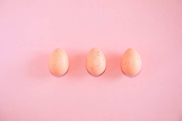 Pink easter eggs on pink background