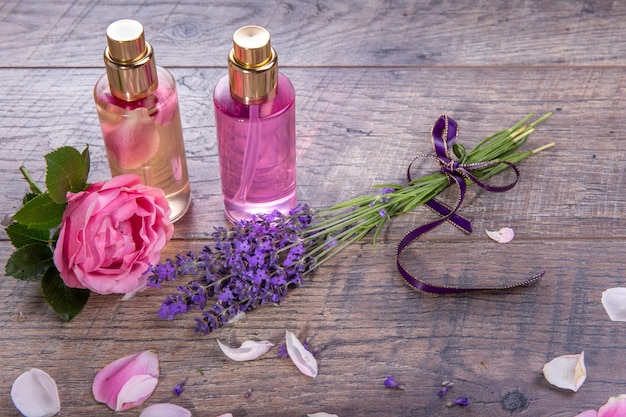 Pink English rose lavender organic salt and oil spa wooden background Rustic style