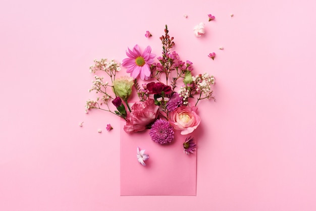 Pink envelope with spring flowers. 