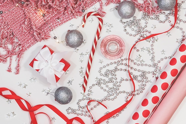 Pink flat lay with New Year decorations.