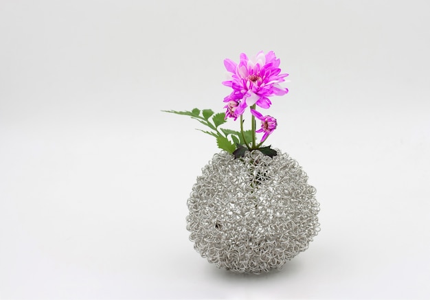 Pink flower bouquet  in vase on white background