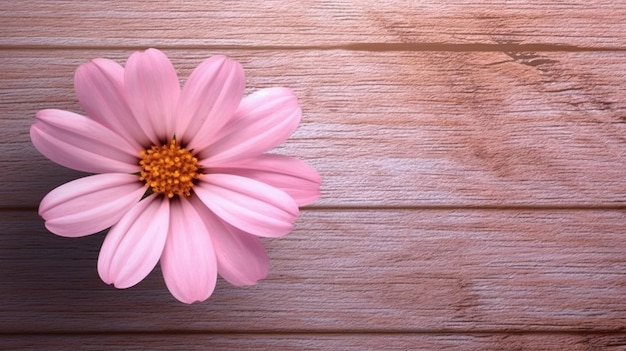 Pink flower in a vase on a wooden table