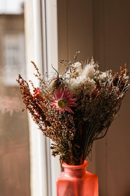 A pink flower in a vase