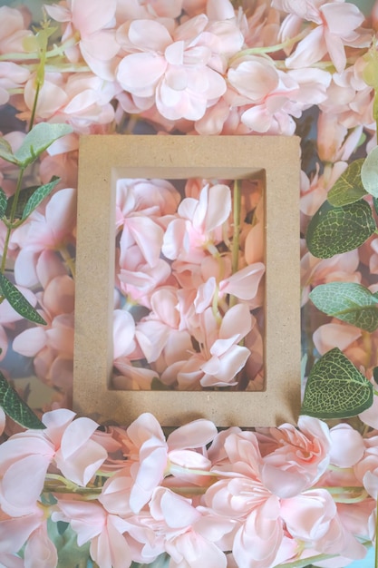 Pink flowers on blue wooden background