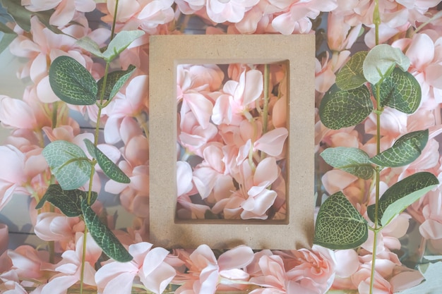 Pink flowers on blue wooden background