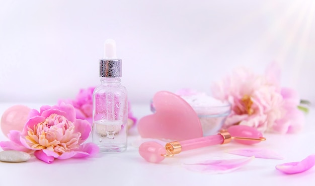 Pink flowers on white background spa facial Selective focus